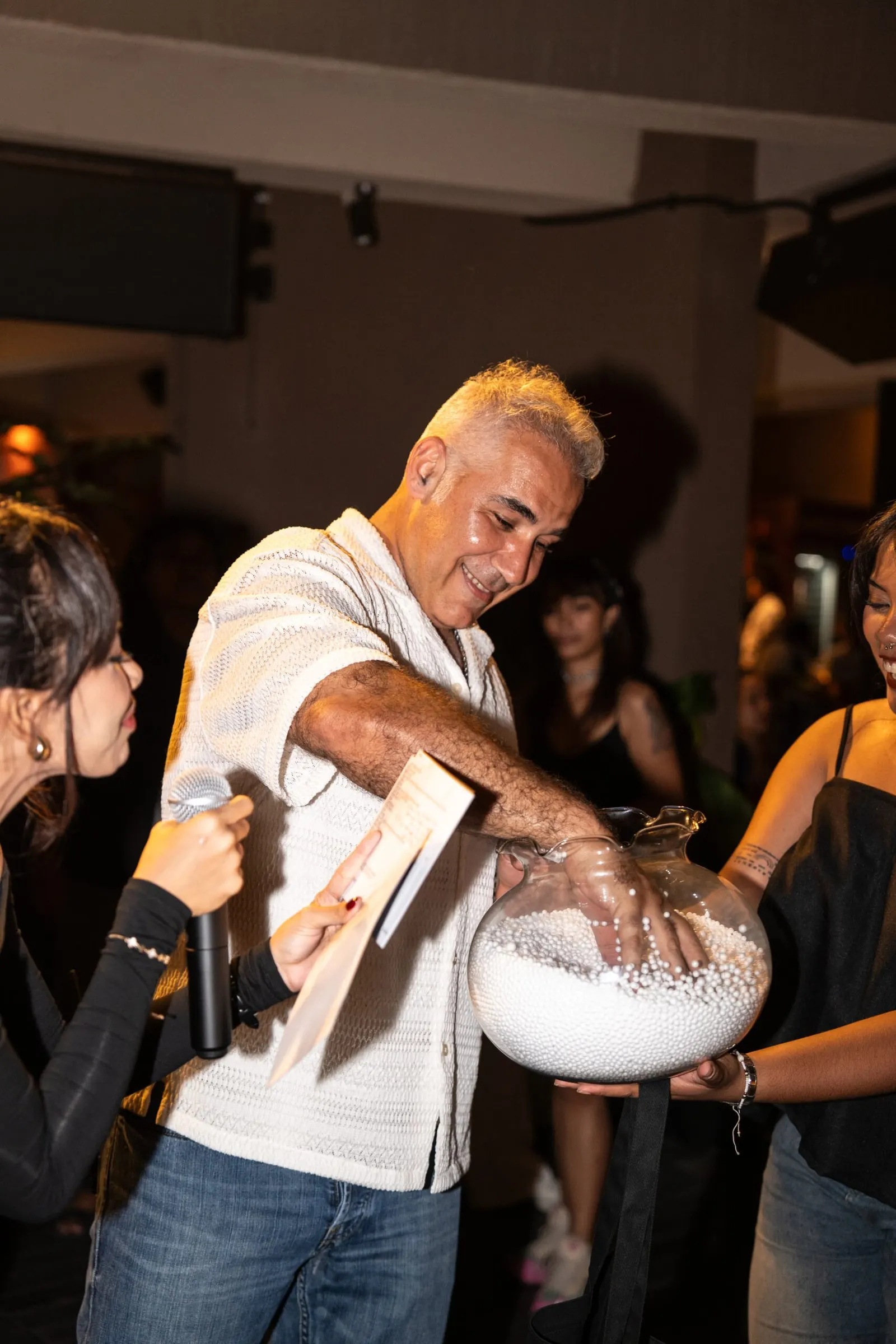 Guests celebrating giveaways and grand prizes at Reload Social in Canggu